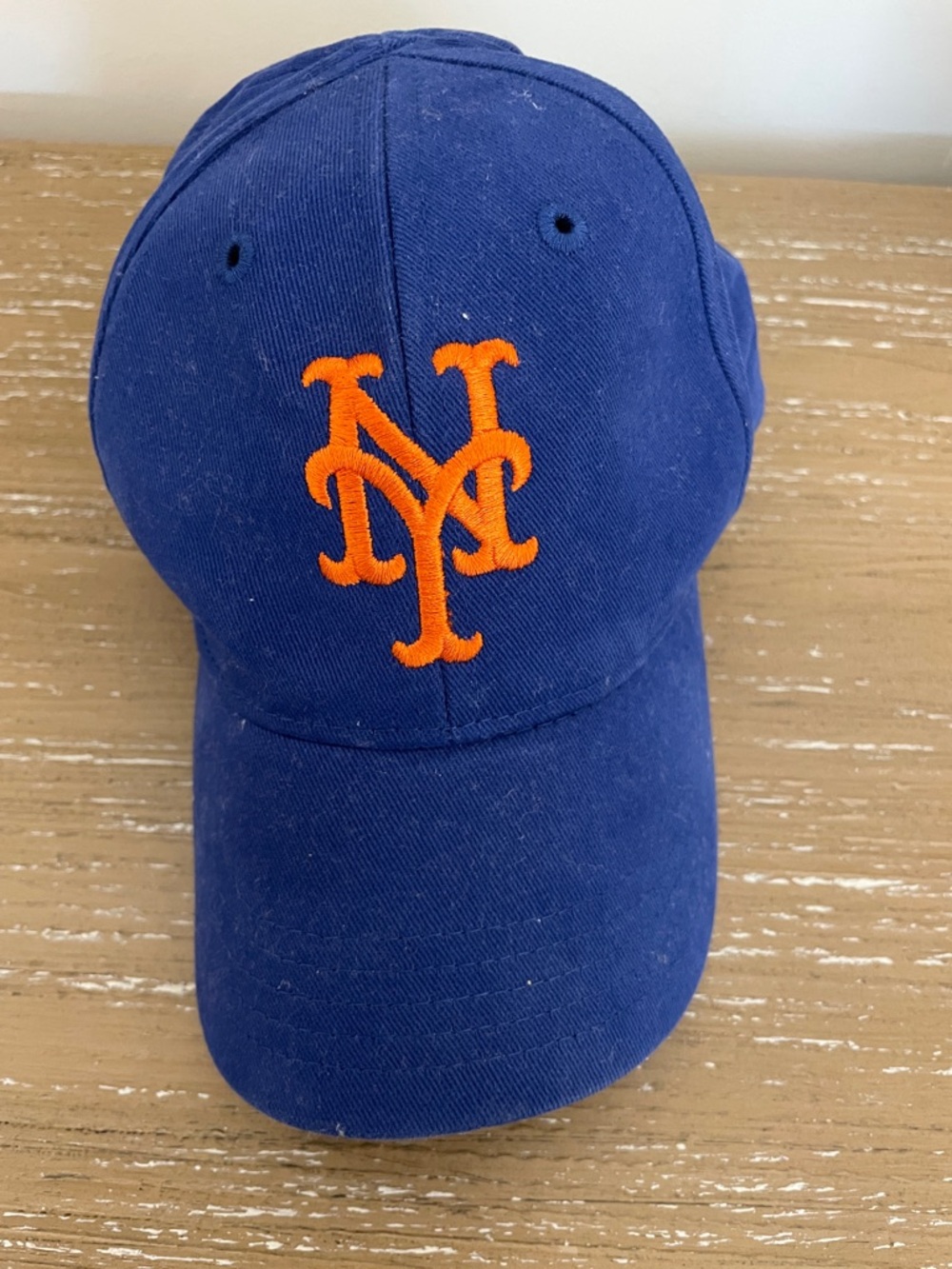 Genuine Merchandise Royal Blue Baseball Cap with Orange Embroidered Logo